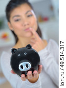 woman not sure about her savings. Стоковое фото, агентство Ingram Publishing / Фотобанк Лори