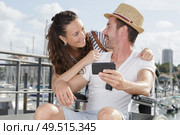 happy couple in love taking selfie in the port. Стоковое фото, агентство Ingram Publishing / Фотобанк Лори