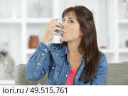 girl suffering from asthma using her inhaler. Стоковое фото, агентство Ingram Publishing / Фотобанк Лори