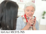 Sad senior woman drinking a coffee. Стоковое фото, агентство Ingram Publishing / Фотобанк Лори