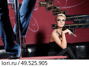 The beautiful girl looks a man?s striptease. Стоковое фото, агентство Ingram Publishing / Фотобанк Лори