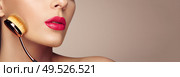 Makeup artist applies skintone with brush. Beautiful woman face. Perfect makeup. Skincare foundation. Brushes makeup artist. Стоковое фото, агентство Ingram Publishing / Фотобанк Лори