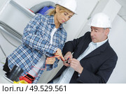 portrait of professional electrician team. Стоковое фото, агентство Ingram Publishing / Фотобанк Лори