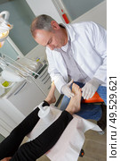 podiatrist working in a clinic. Стоковое фото, агентство Ingram Publishing / Фотобанк Лори