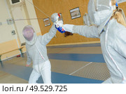 portrait of a couple of fencing players. Стоковое фото, агентство Ingram Publishing / Фотобанк Лори