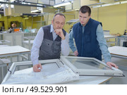 production workers with different pvc window. Стоковое фото, агентство Ingram Publishing / Фотобанк Лори