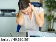 female office worker massaging aching neck. Стоковое фото, агентство Ingram Publishing / Фотобанк Лори