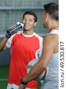 a footballeur is drinking water. Стоковое фото, агентство Ingram Publishing / Фотобанк Лори