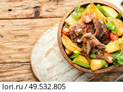 Roasted meat.Plate of grilled meat and potatoes. Baked meat with potatoes. Стоковое фото, агентство Ingram Publishing / Фотобанк Лори