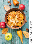 Seasonal autumn salad, grated apples with carrots.. Grated ripe apples. Стоковое фото, агентство Ingram Publishing / Фотобанк Лори