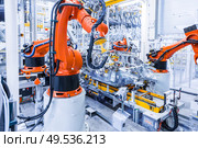 robotic arms in a car plant. robots in a car plant. Стоковое фото, агентство Ingram Publishing / Фотобанк Лори