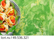 Festive, banquet pasta dish stuffed with red caviar.Macaroni stuffed with salmon caviar.. Red caviar stuffed pasta. Стоковое фото, агентство Ingram Publishing / Фотобанк Лори