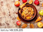 Seasonal autumn salad, grated apples with carrots.. Grated ripe apples. Стоковое фото, агентство Ingram Publishing / Фотобанк Лори