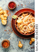 Salad of Jerusalem artichoke and horseradish roots, vegetarian side dish.. Jerusalem artichoke salad. Стоковое фото, агентство Ingram Publishing / Фотобанк Лори