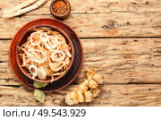 Salad of Jerusalem artichoke and horseradish roots, vegetarian side dish.. Jerusalem artichoke salad. Стоковое фото, агентство Ingram Publishing / Фотобанк Лори