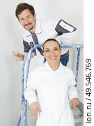 a team of painters after painting. Стоковое фото, агентство Ingram Publishing / Фотобанк Лори