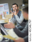 businessman asks silence during a successful telephone conversation. Стоковое фото, агентство Ingram Publishing / Фотобанк Лори