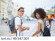 young tourist couple visiting bordeaux holding city map. Стоковое фото, агентство Ingram Publishing / Фотобанк Лори
