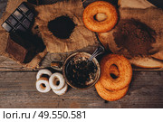 Delicious lifestyle of a warm chocolate cup and sweeties. Стоковое фото, агентство Ingram Publishing / Фотобанк Лори