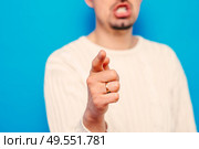 Young man showing his index finger towards the camera. Стоковое фото, агентство Ingram Publishing / Фотобанк Лори