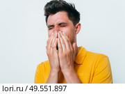 man laughs and covers her mouth. Стоковое фото, агентство Ingram Publishing / Фотобанк Лори