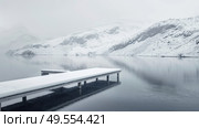 A dock on a lake covered in snow, showcasing winter scenery with a tranquil atmosphere. Стоковое AI-изображение, AI-художник Данила Большаков / Фотобанк Лори