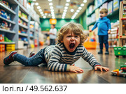 A little boy is lying on the floor in a store. Childish hysteria. The child screams, sobs, gets cranky and gets hysterical. Discontent. Стоковое AI-изображение, AI-художник Photojuli / Фотобанк Лори
