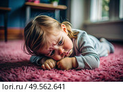 A little girl is lying on the floor. Childish hysteria. The child screams, sobs, gets cranky and gets hysterical. Discontent. Стоковое AI-изображение, AI-художник Photojuli / Фотобанк Лори