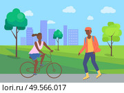 Boy rollerblading in casual clothes and afro-american woman riding on bike, people in city part. Man wearing helmet, person on rollerblades, urban activity vector. Flat cartoon. Boy Rollerblading and Woman Riding on Bike in Park. Стоковая иллюстрация, агентство Ingram Publishing / Фотобанк Лори