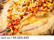 Appetizing flounder or flat-fish baked with vegetables.Fried fish with vegetable filling. Flounder with vegetables on table. Стоковое фото, агентство Ingram Publishing / Фотобанк Лори