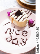 cake with chocolate  served  at plate with "nice day" sign. life style concept. Стоковое фото, агентство Ingram Publishing / Фотобанк Лори