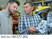 future mechanical engineer studying bluprint. Стоковое фото, агентство Ingram Publishing / Фотобанк Лори