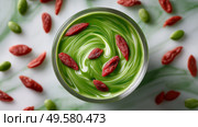Smoothie glass with spirulina and goji berries swirling inside like a magical potion. Стакан для смузи со спирулиной и ягодами годжи, закрученными внутри, как волшебное зелье. Стоковое AI-изображение, AI-художник Katsiaryna Repich / Фотобанк Лори