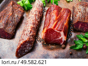 Italian meat platter.Cured meat and sausages.Smoked meat. Cured meat platter. Стоковое фото, агентство Ingram Publishing / Фотобанк Лори