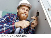 electrical renovation work wiring in pipe wall. Стоковое фото, агентство Ingram Publishing / Фотобанк Лори