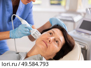 Mature woman receiving hardware facial procedure using cooling attachment. Стоковое фото, фотограф Яков Филимонов / Фотобанк Лори