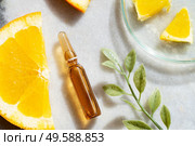 Citrus fruit vitamin c serum oil beauty care, anti aging natural cosmetic, laboratory testing concept, close up view. Citrus fruit vitamin c serum oil beauty care. Стоковое фото, агентство Ingram Publishing / Фотобанк Лори