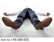 Young, tired businessman having a nap - isolated. Стоковое фото, агентство Ingram Publishing / Фотобанк Лори