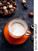 healthy natural  macadamia nuts dessert and coffee served at black table.food  and wellness concept . Стоковое фото, агентство Ingram Publishing / Фотобанк Лори