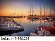 Marina with docked yachts at sunset in Giulianova, Italy. Стоковое фото, агентство Ingram Publishing / Фотобанк Лори