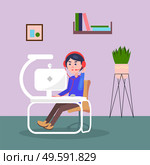 Manager of call-centre or tech support. Quarantine distance work. Freelance work at home. Young guy wearing headphones with headset talking with customer. Modern computer with webcam, lamp at table. Manager of call-centre working at home, distance work, freelance work during quarantine isolation. Стоковая иллюстрация, агентство Ingram Publishing / Фотобанк Лори