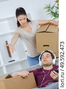 young woman threatening husband at home. Стоковое фото, агентство Ingram Publishing / Фотобанк Лори
