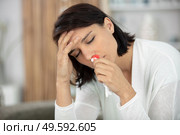 woman with nosebleed or epistaxis. Стоковое фото, агентство Ingram Publishing / Фотобанк Лори