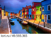 Colourfully painted houses facade on Burano island in evening, province of Venice, Italy. Colourful evening houses on Burano island, Venice. Стоковое фото, агентство Ingram Publishing / Фотобанк Лори