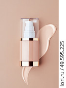 Foundation bottle with liquid foundation. Advertising of foundation cream, concealer, base, BB cream. Стоковое фото, агентство Ingram Publishing / Фотобанк Лори