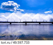 Colorful sight: cooling fountains of the Atomic Station, Heat of a power plant against a background of white clouds and blue sky.. Colorful sight: cooling fountains of the Atomic Station, Heat of a power plant against a background of white clouds, blue sky. Стоковое фото, агентство Ingram Publishing / Фотобанк Лори