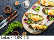 Bruschetta with poached egg,cucumber and fried mushrooms with hollandaise sauce.Tasty eggs benedict. Eggs benedict with stewed mushrooms. Стоковое фото, агентство Ingram Publishing / Фотобанк Лори