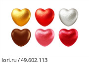 Set of realistic heart shaped chocolates wrapped in foil candy wrapper. Festive design element for Happy Valentines Day. Vector illustration EPS10. Set of realistic heart shaped chocolates wrapped in foil candy wrapper. Festive design element for Happy Valentines Day. Vector illustration. Стоковая иллюстрация, агентство Ingram Publishing / Фотобанк Лори