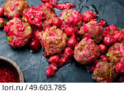 Arabic food lamb kufta spiced with saffron.Appetizing lamb meatballs. Syrian kyufta with cherry. Стоковое фото, агентство Ingram Publishing / Фотобанк Лори