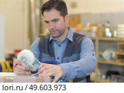 preparing his stamp of approval. Стоковое фото, агентство Ingram Publishing / Фотобанк Лори